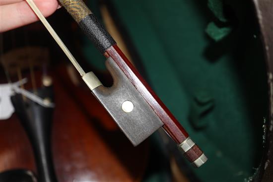 A German Strad style violin and a small violin and two bows